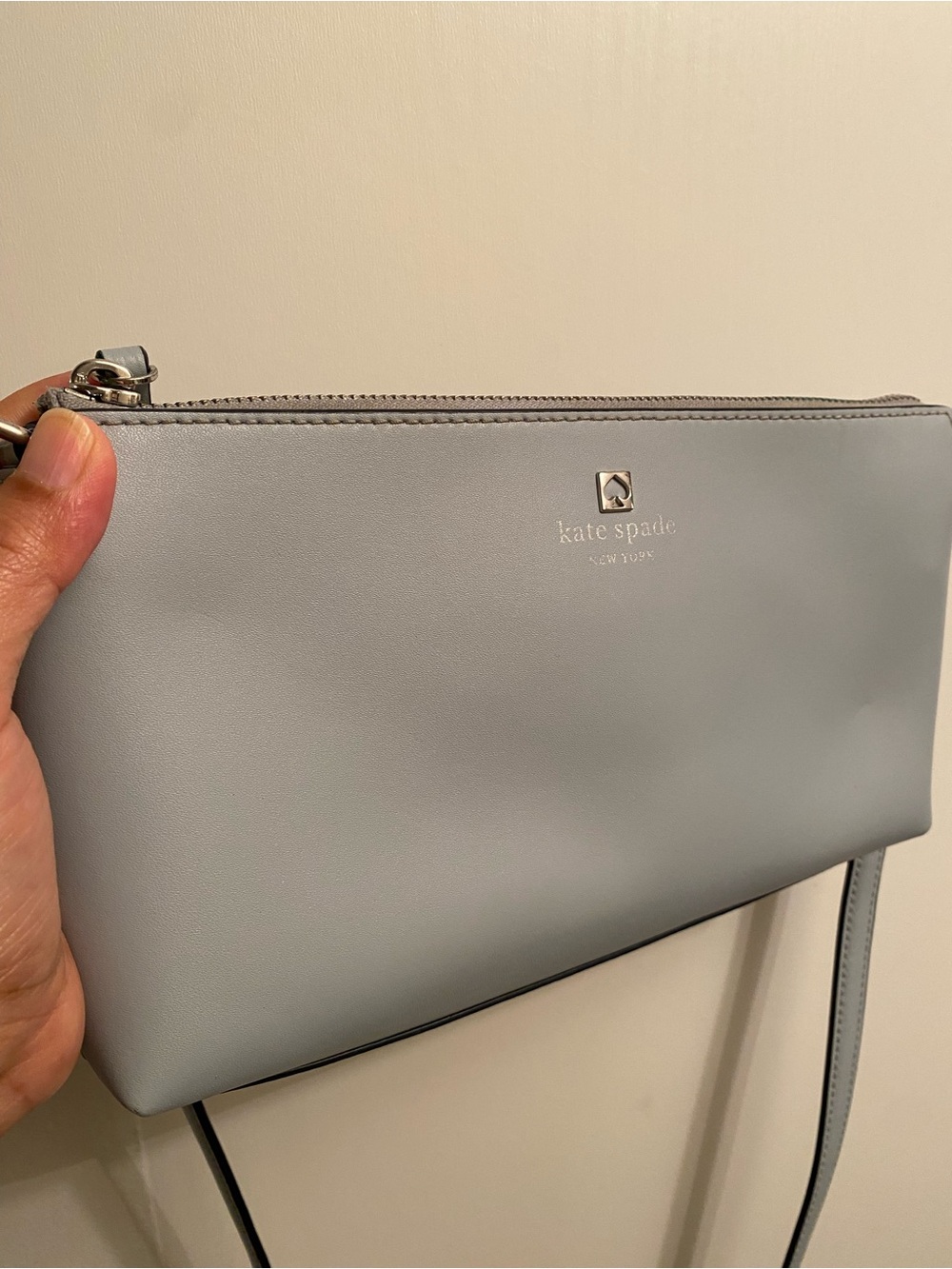 Kate Spade light gray leather crossbody bag with gold spade logo